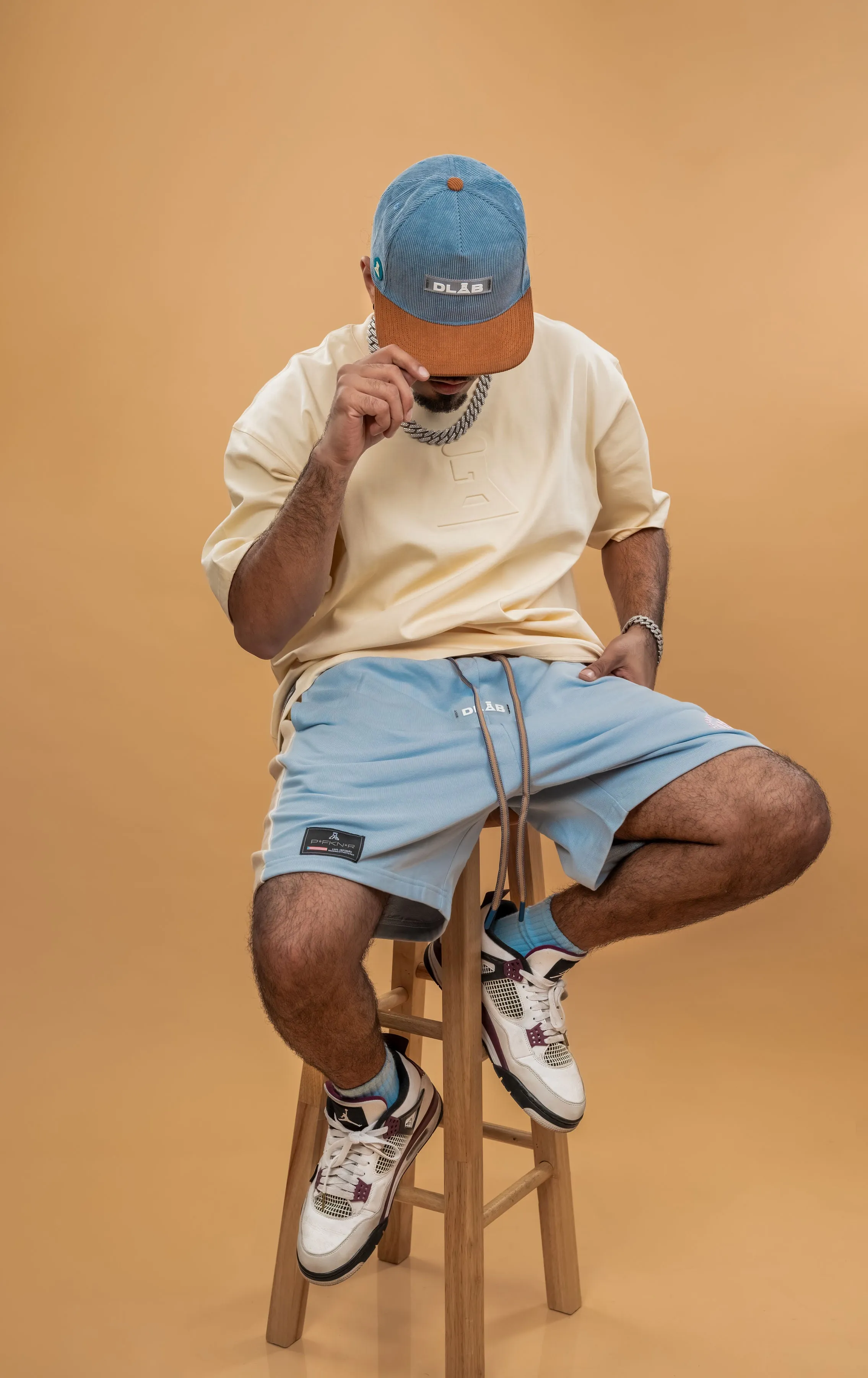 Certainly! Heres an optimized title with modifiers for the e-commerce product:

Stylish DLAB Oversized Shorts - Baby Blue, Cream & Brown | Comfortable & Trendy Casual Wear

This title uses adjectives like Stylish, Comfortable, and Trendy to attract potential buyers, while also including all the color options.