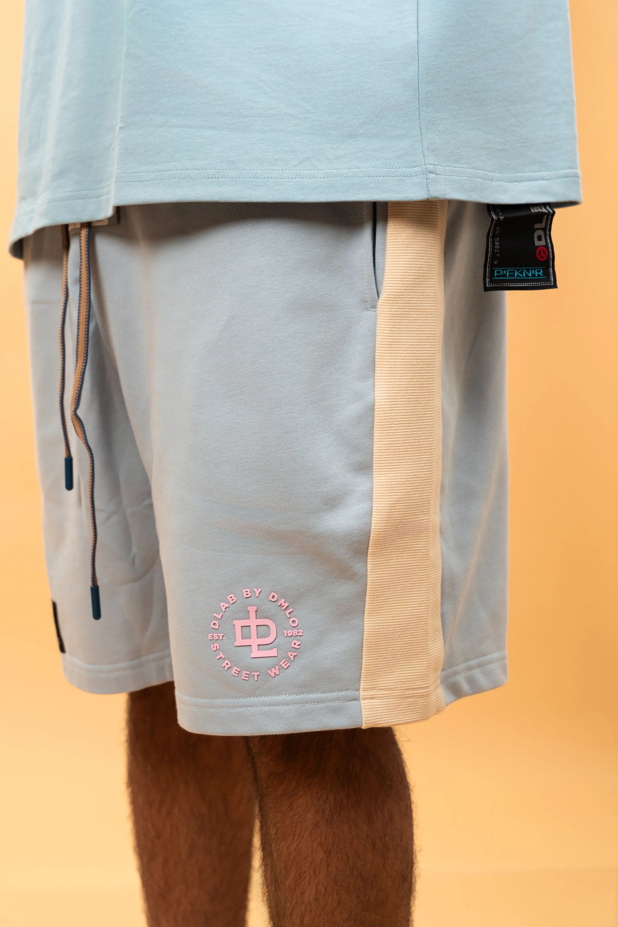 Certainly! Heres an optimized title with modifiers for the e-commerce product:

Stylish DLAB Oversized Shorts - Baby Blue, Cream & Brown | Comfortable & Trendy Casual Wear

This title uses adjectives like Stylish, Comfortable, and Trendy to attract potential buyers, while also including all the color options.