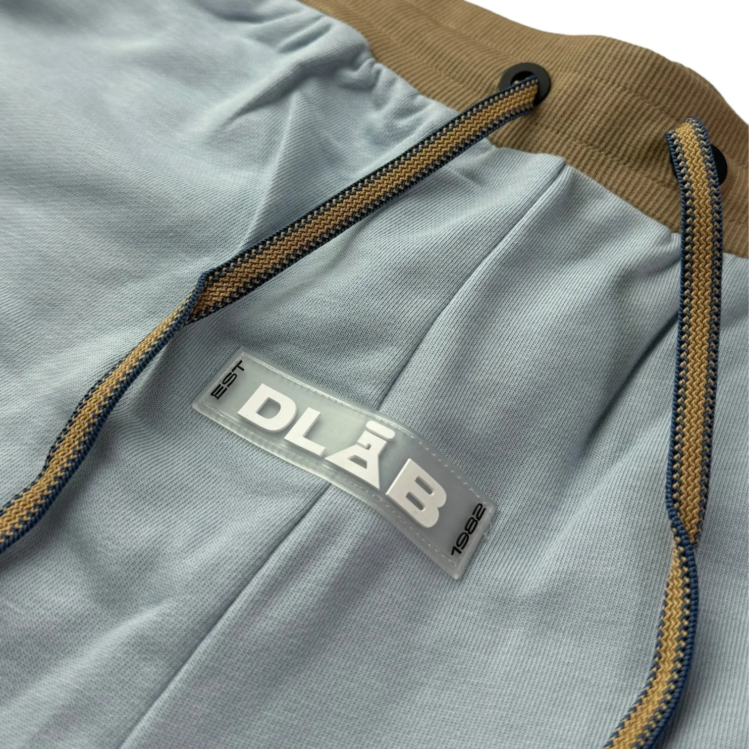 Certainly! Heres an optimized title with modifiers for the e-commerce product:

Stylish DLAB Oversized Shorts - Baby Blue, Cream & Brown | Comfortable & Trendy Casual Wear

This title uses adjectives like Stylish, Comfortable, and Trendy to attract potential buyers, while also including all the color options.